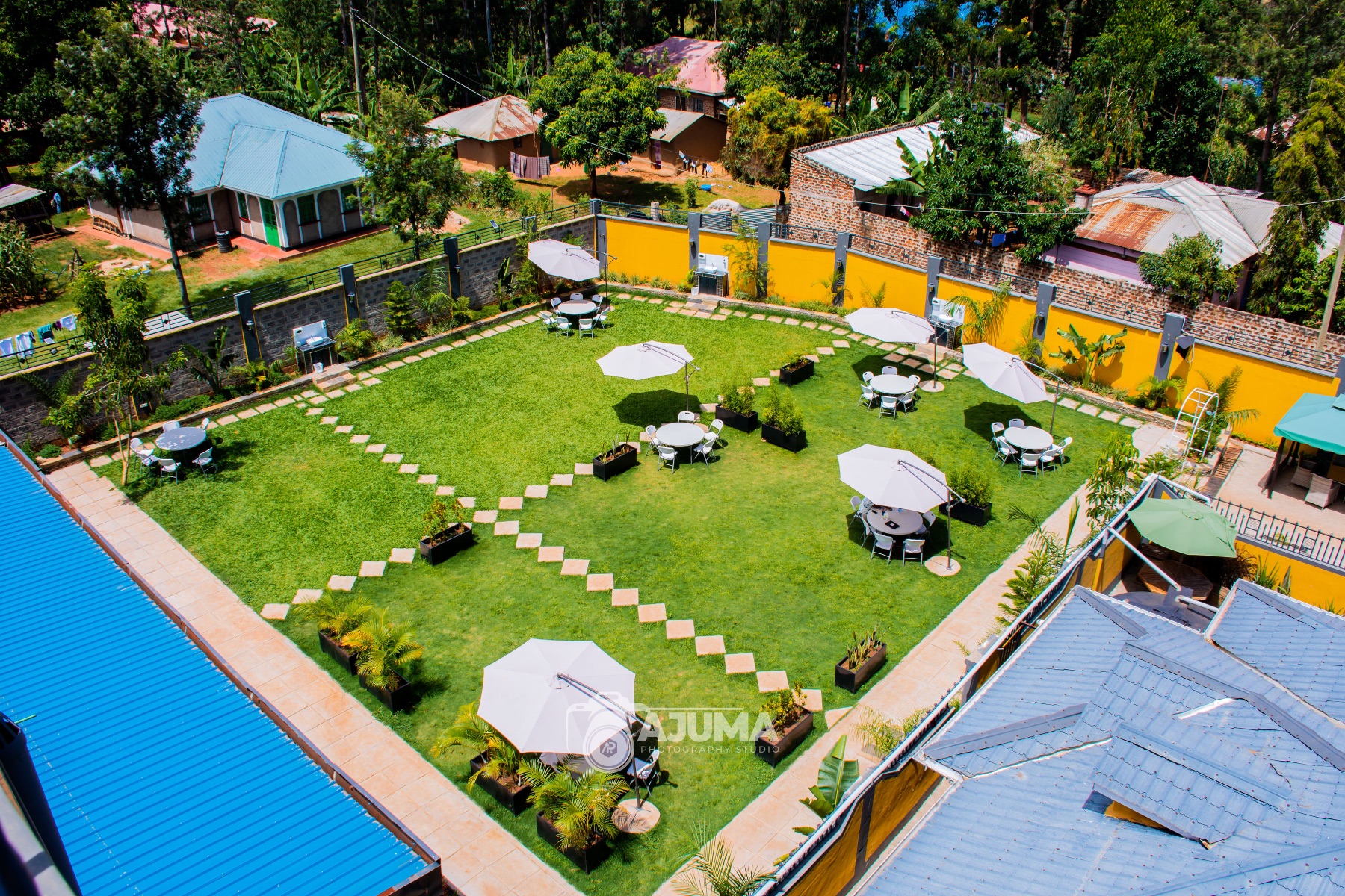 The garden lawn from above, set with umbrellas